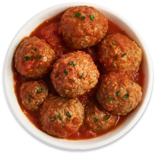 A white bowl filled with large meatballs in tomato sauce, garnished with chopped herbs. The dish, reminiscent of Mama Mancini's classic recipes, appears appetizing and savory. _MamaMancinis